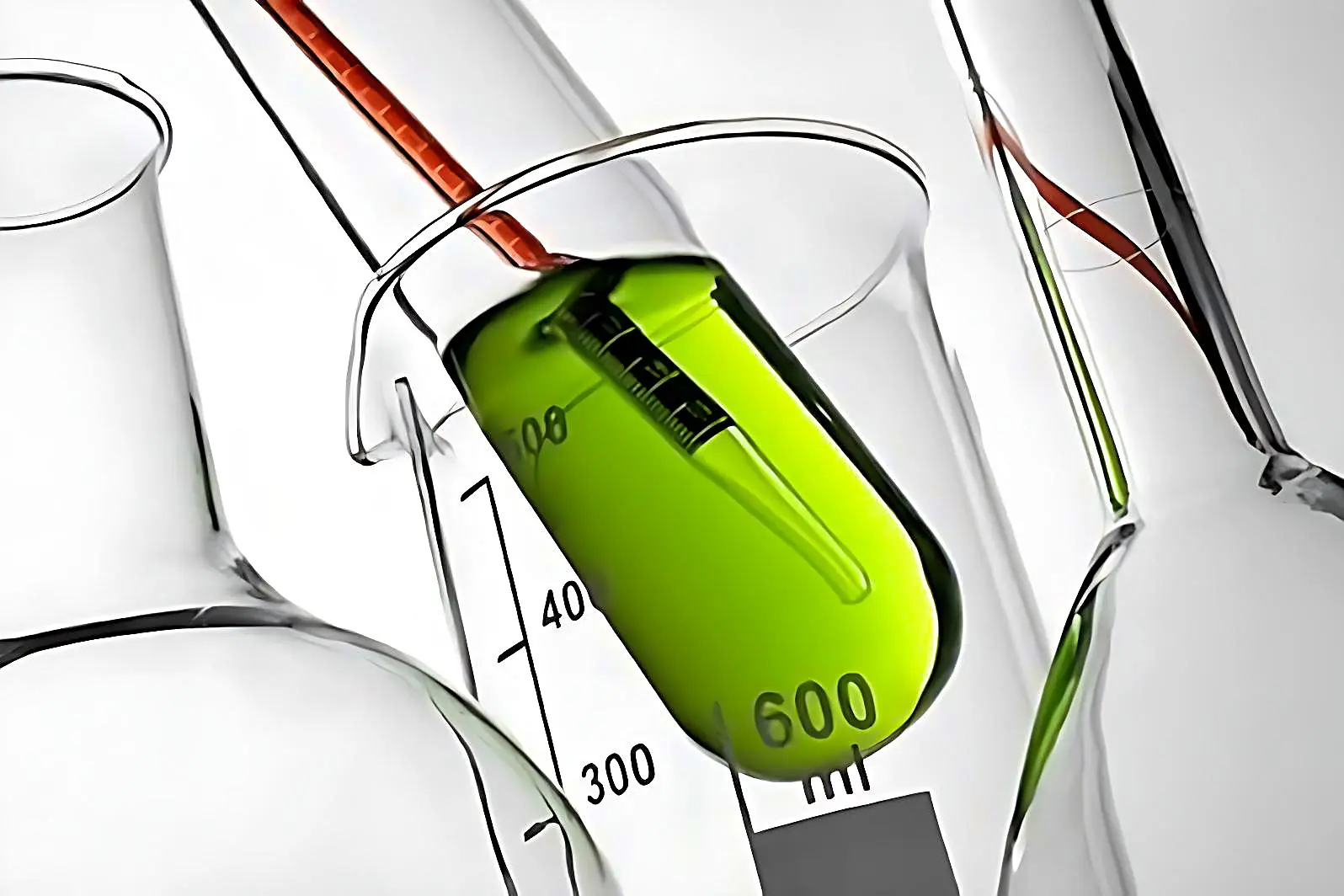 A test tube with a green liquid inside a flask